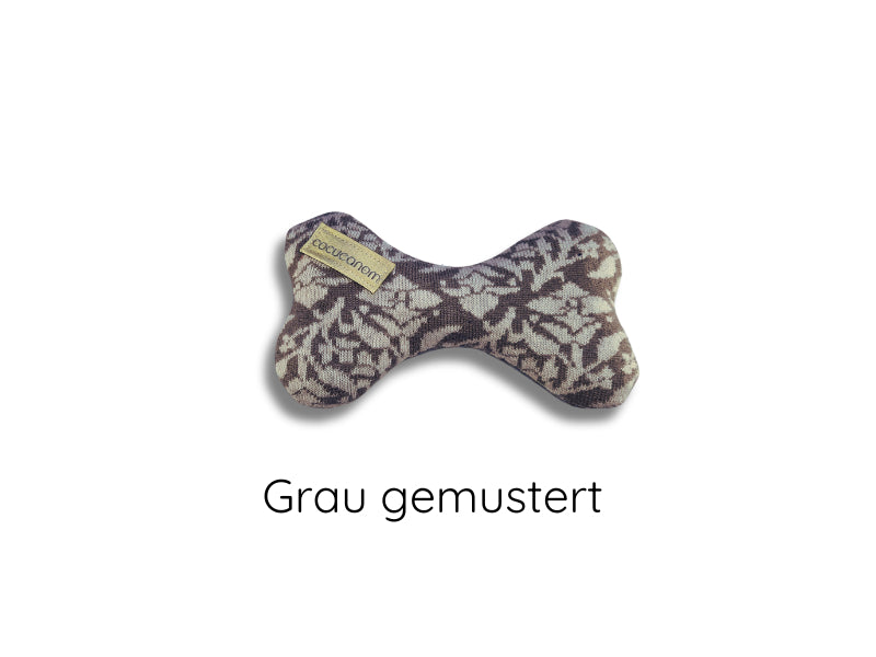 Plüschknochen für kleine Hunde. Die Vorderseite ist grau mit einem weißen, floralem Muster.